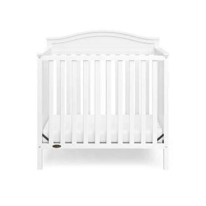 Graco Stella 4-In-1 Convertible Mini Crib with Bonus Mattress (White) – Includes Bonus 2.50 Inch Thick Mattress with Water-Resistant Cover, Converts to Twin Bed with Headboard and Footboard