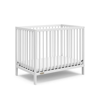 Graco Teddi 4-In-1 Convertible Mini Crib with Bonus Water-Resistant Mattress (Driftwood) – GREENGUARD Gold Certified, 2.75-Inch Mattress Included, Convenient Size, Easy 30-Minute Assembly