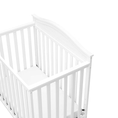 Graco Stella 4-In-1 Convertible Mini Crib with Bonus Mattress (White) – Includes Bonus 2.50 Inch Thick Mattress with Water-Resistant Cover, Converts to Twin Bed with Headboard and Footboard