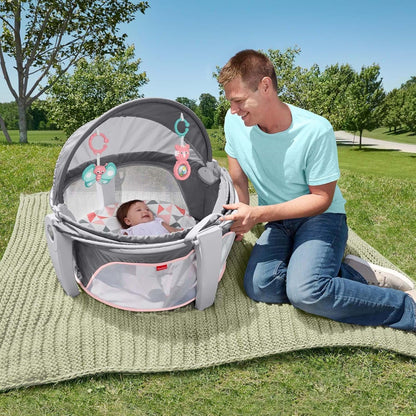 Fisher-Price Portable Bassinet On-The-Go Baby Dome, Travel Play Space with Developmental Newborn Toys & Canopy, Rosy Windmill