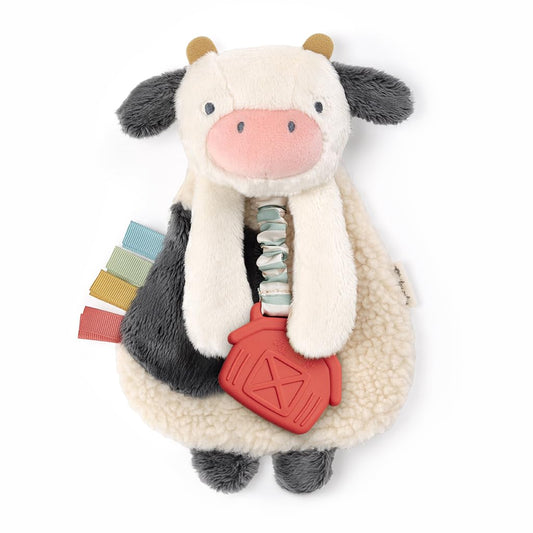 Itzy Ritzy - Itzy Lovey Including Teether - Baby Lovey with Teether, Textured Ribbons & Dangle Arms - Features Crinkle Sound, Sherpa Fabric and Minky Plush (Cow)